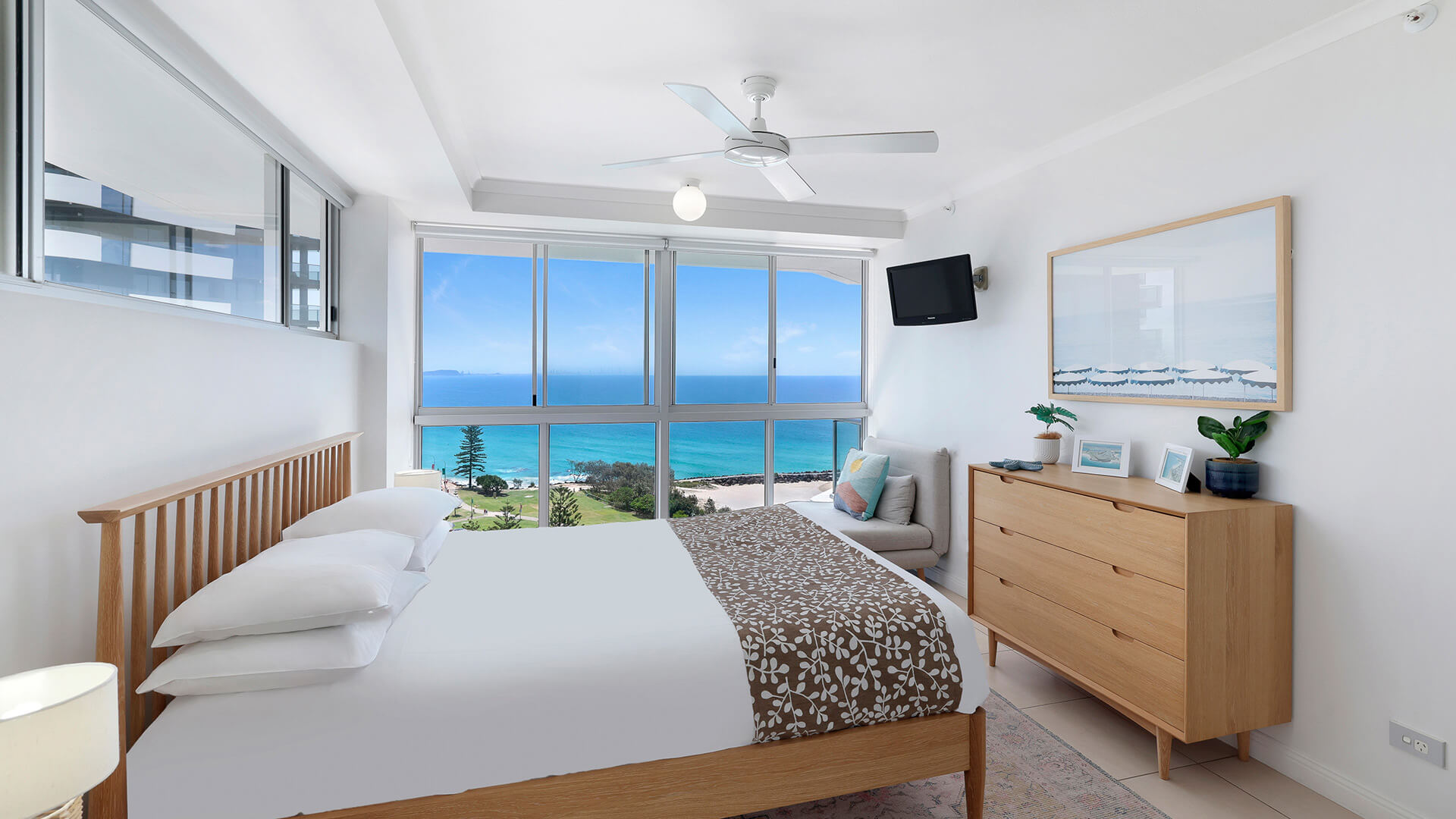 Master bedroom in the Standard 2 Bedroom Ocean View Apartment at ULTIQA Points North, featuring panoramic ocean views.