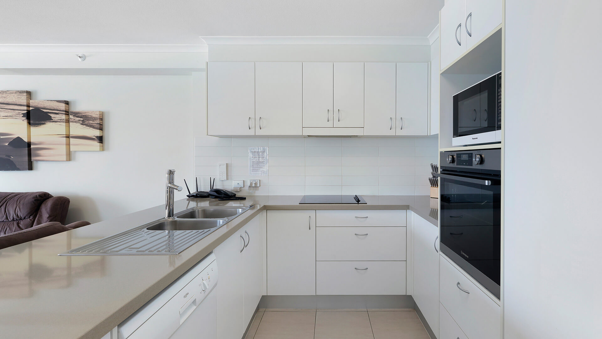 Modern kitchen in the Deluxe 2 Bedroom Centre Front Apartment at ULTIQA Points North with full appliances.