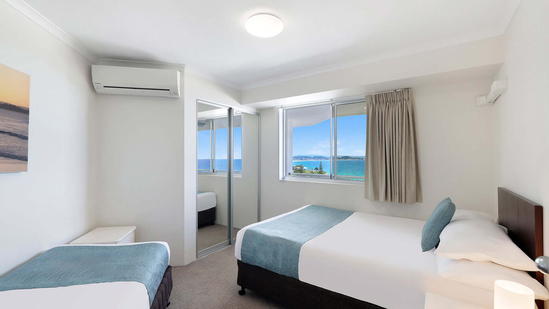 Second bedroom in the Deluxe 2 Bedroom Centre Front Apartment at ULTIQA Points North with ocean views.
