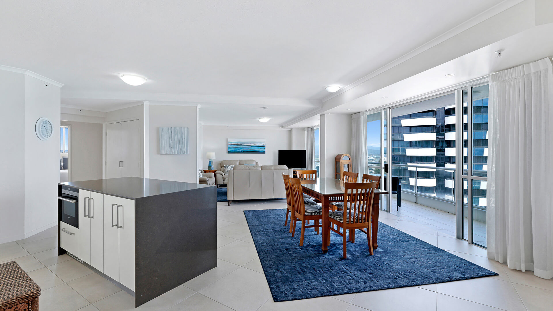 Spacious open-plan kitchen, dining, and living area in the Superior 3 Bedroom Ocean View Apartment.