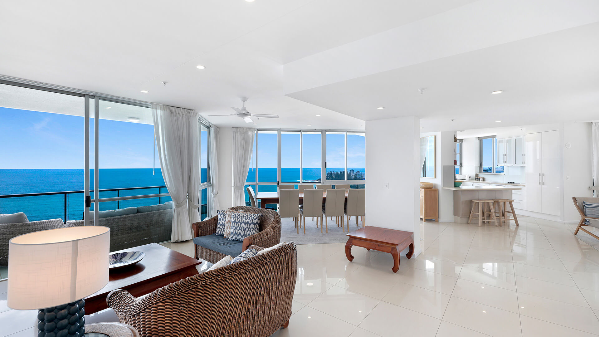 Open-plan living, dining, and kitchen area of the 4 Bedroom Oceanfront Penthouse at ULTIQA Points North with sweeping ocean views.