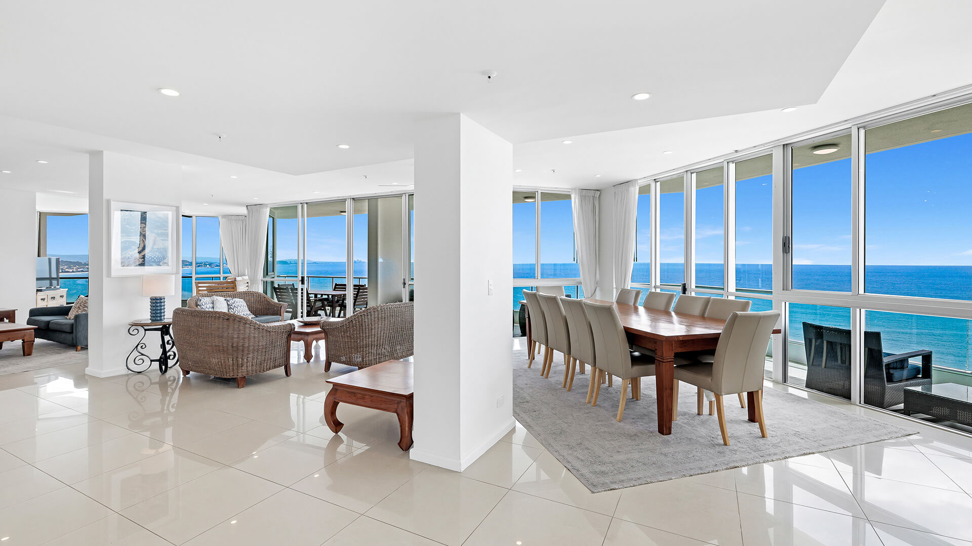 Spacious open-plan living and dining area of the 4 Bedroom Oceanfront Penthouse at ULTIQA Points North with panoramic ocean views.