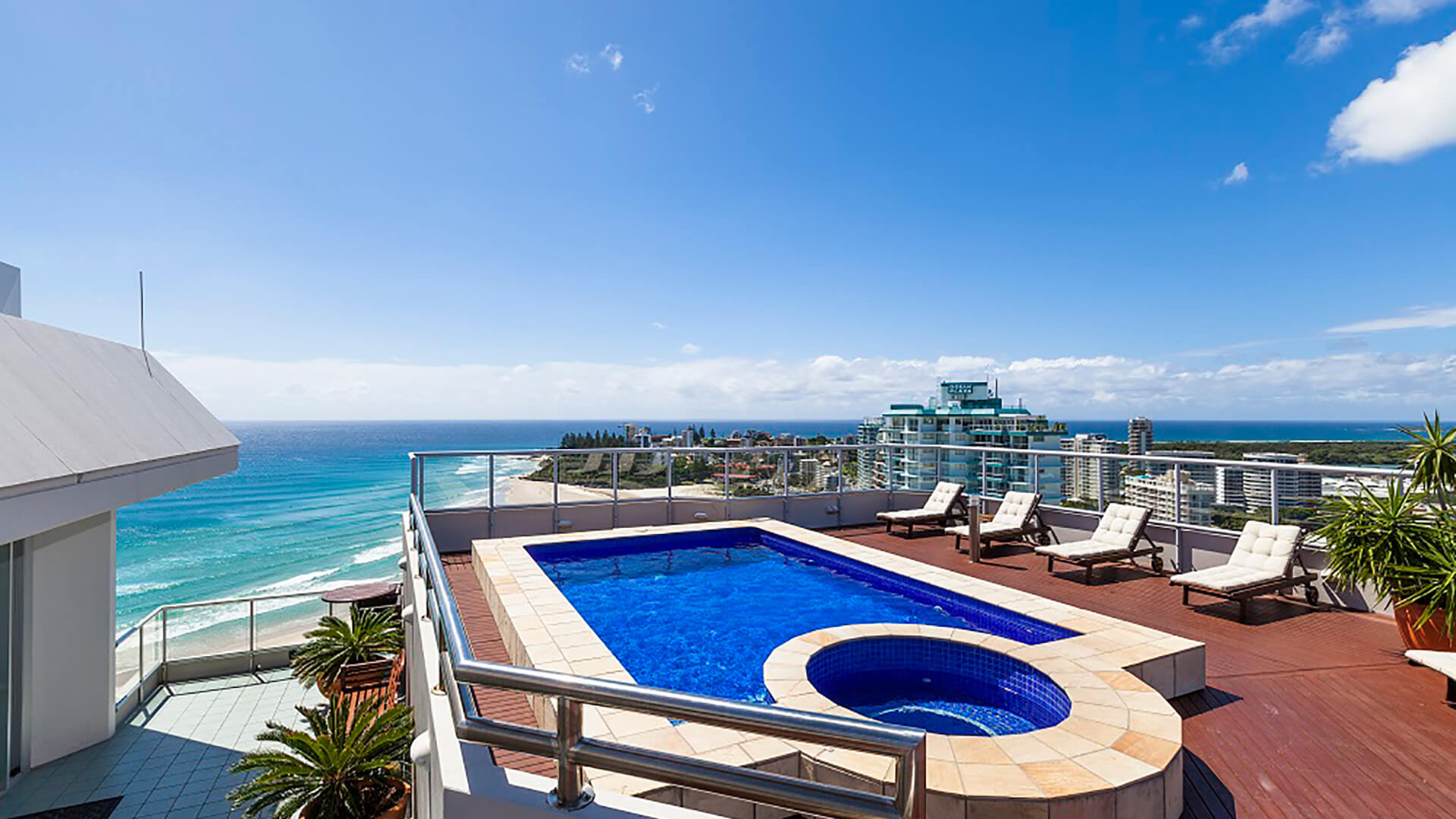 Rooftop pool and spa of the 4 Bedroom Oceanfront Penthouse at ULTIQA Points North with panoramic ocean and city views.