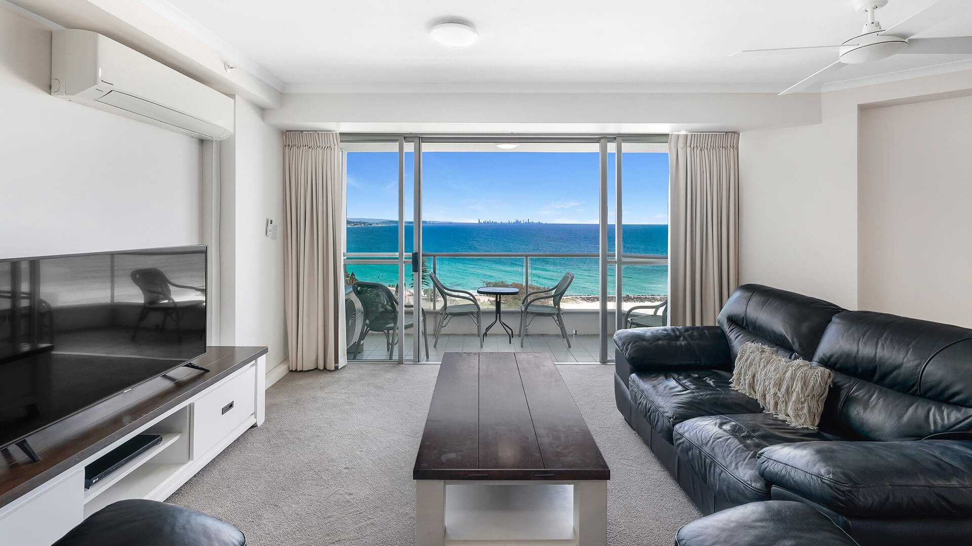 Spacious oceanfront lounge area with furnished patio & Ocean Views in the Superior 1 Bedroom Ocean View Apartment at ULTIQA Points North.