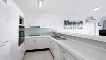Fully equipped kitchen in the Standard 2 Bedroom Centre Front Apartment, featuring ample bench space and modern appliances.