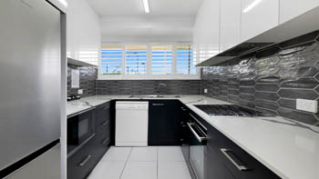 Modern fully equipped kitchen in the Superior 2 Bedroom Courtyard Apartment at ULTIQA Points North.