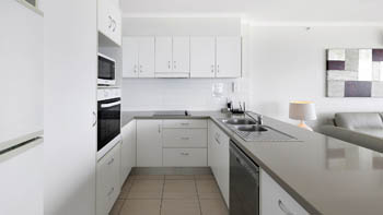 Fully equipped modern kitchen in the Deluxe 2 Bedroom Centre Front Apartment at ULTIQA Points North.