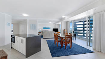 Spacious open-plan kitchen, dining, and living area in the Superior 3 Bedroom Ocean View Apartment.