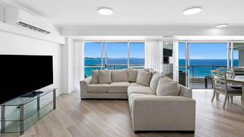 Spacious living area with ocean views in the Deluxe 3 Bedroom Ocean View Apartment at ULTIQA Points North Coolangatta.