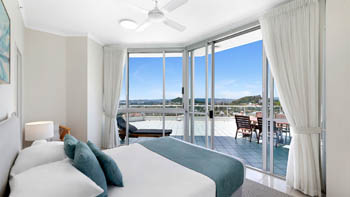 Bedroom in the 4 Bedroom Oceanfront Penthouse at ULTIQA Points North with terrace and hinterland views.
