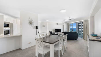 Kitchen and living area in the Superior 1 Bedroom Ocean View Apartment at ULTIQA Points North.
