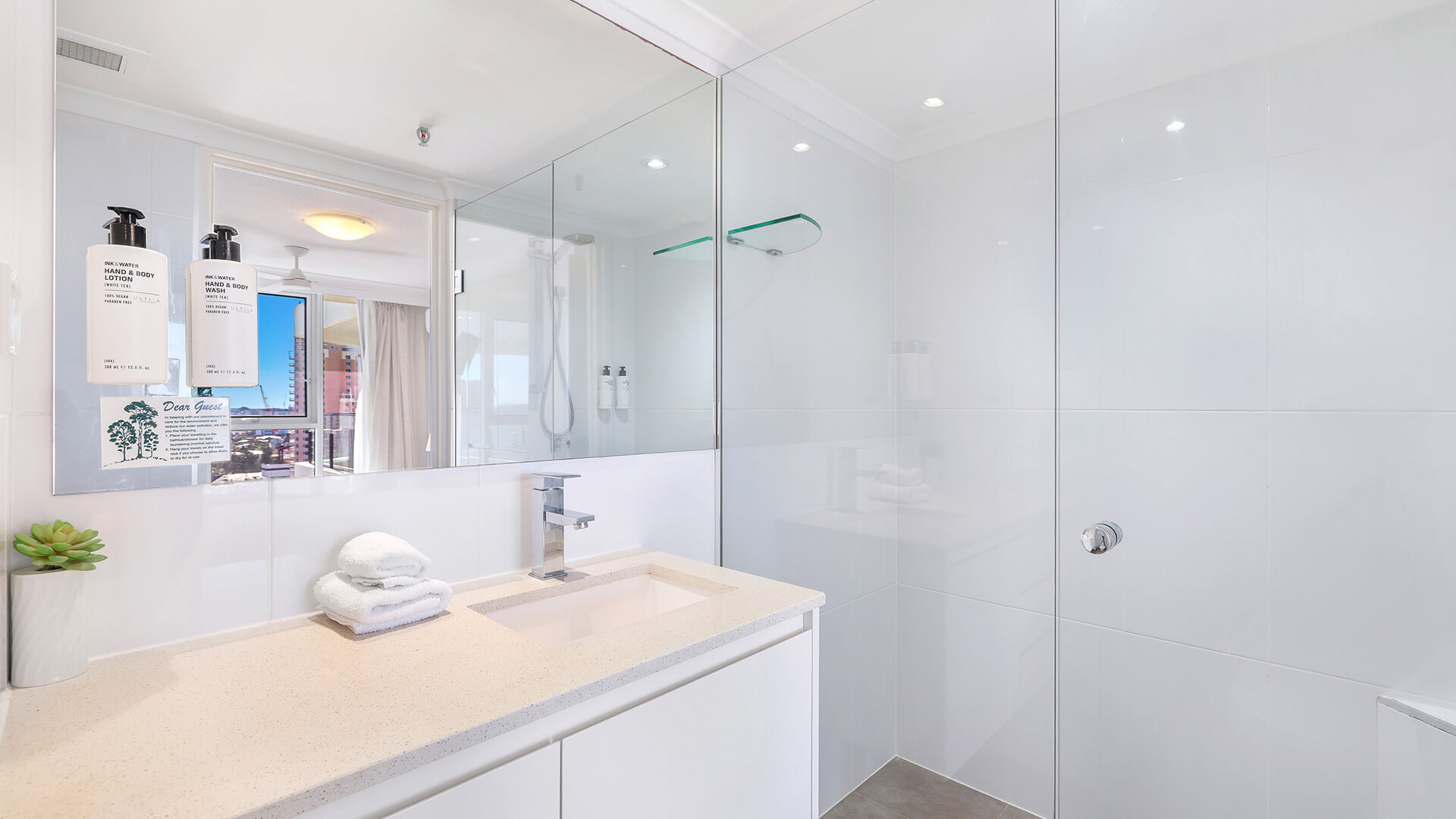 Contemporary bathroom with walk-in shower at ULTIQA Beach Haven, Surfers Paradise apartment
