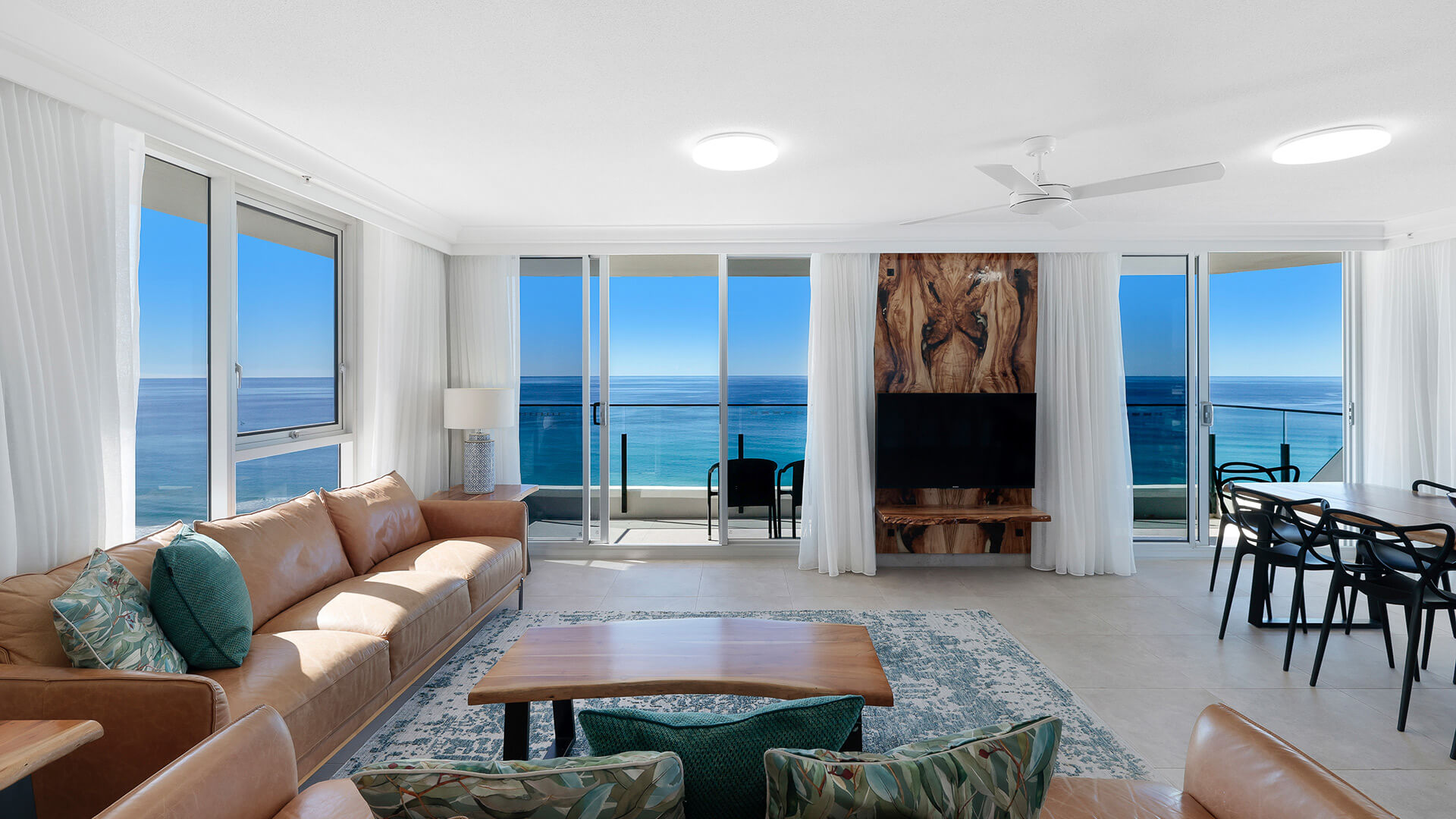Lounge with balcony access and uninterrupted ocean views at ULTIQA Beach Haven, Surfers Paradise