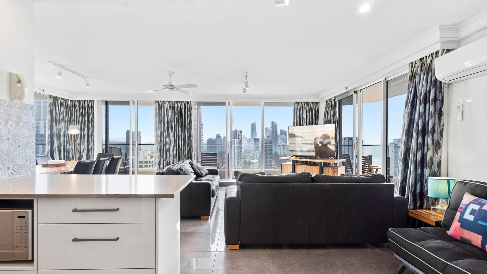 Living room with a view of Gold coast at ULTIQA Beach Haven.