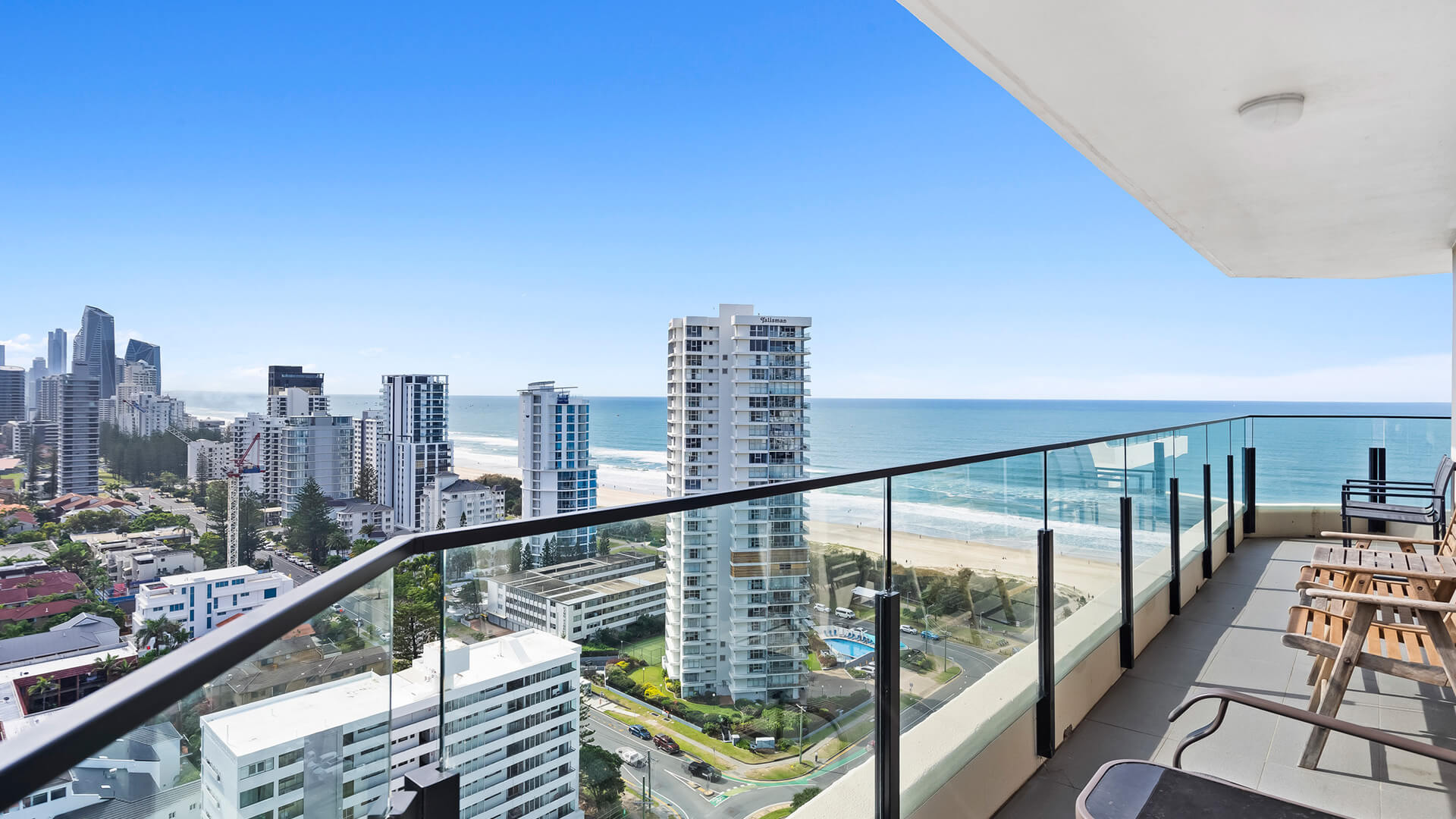 View of the Gold Coast shoreline and ocean in the background from the balcony at ULTIQA Beach Haven.