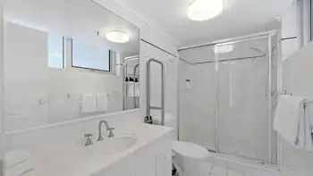 Main bathroom with walk-in shower and large vanity in the 2 Bedroom Apartment at ULTIQA Beach Haven on Broadbeach.