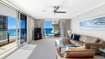 Living room in the 2 Bedroom Ocean View Apartment at ULTIQA Beach Haven on Broadbeach with leather seating and panoramic ocean views.