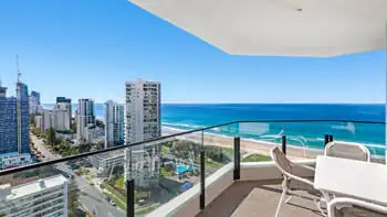 Outdoor dining setting on the balcony in the 2 Bedroom Ocean View Apartment at ULTIQA Beach Haven on Broadbeach with panoramic views of the Gold Coast skyline and golden beachfront.