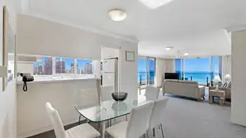 Open-plan dining and lounge area with ocean views in the Standard 2 Bedroom Ocean View Apartment at ULTIQA Beach Haven on Broadbeach.