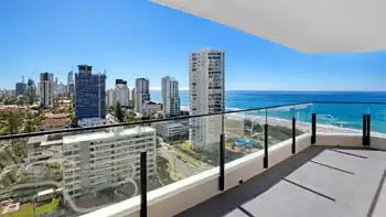 Spacious balcony with panoramic ocean and skyline views at the Standard 2 Bedroom Ocean View Apartment at ULTIQA Beach Haven on Broadbeach.