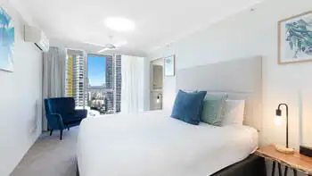 Master bedroom in the Premium 2 Bedroom Ocean View Apartment at ULTIQA Beach Haven on Broadbeach with city views and king bed.