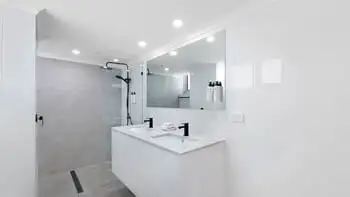 Bathroom in the Premium 2 Bedroom Ocean View Apartment at ULTIQA Beach Haven on Broadbeach, featuring a walk-in shower and dual vanity.