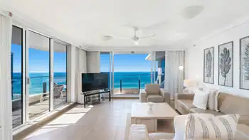 Bright lounge with floor-to-ceiling glass and beachfront views at ULTIQA Beach Haven on Broadbeach, Surfers Paradise.