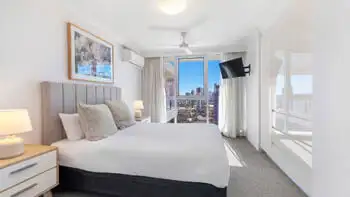 Main bedroom with city views and built-in robes at ULTIQA Beach Haven on Broadbeach, Surfers Paradise accommodation.