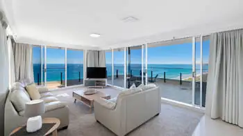 Dining and lounge area with stunning ocean views in the Sub Penthouse at ULTIQA Beach Haven on Broadbeach.