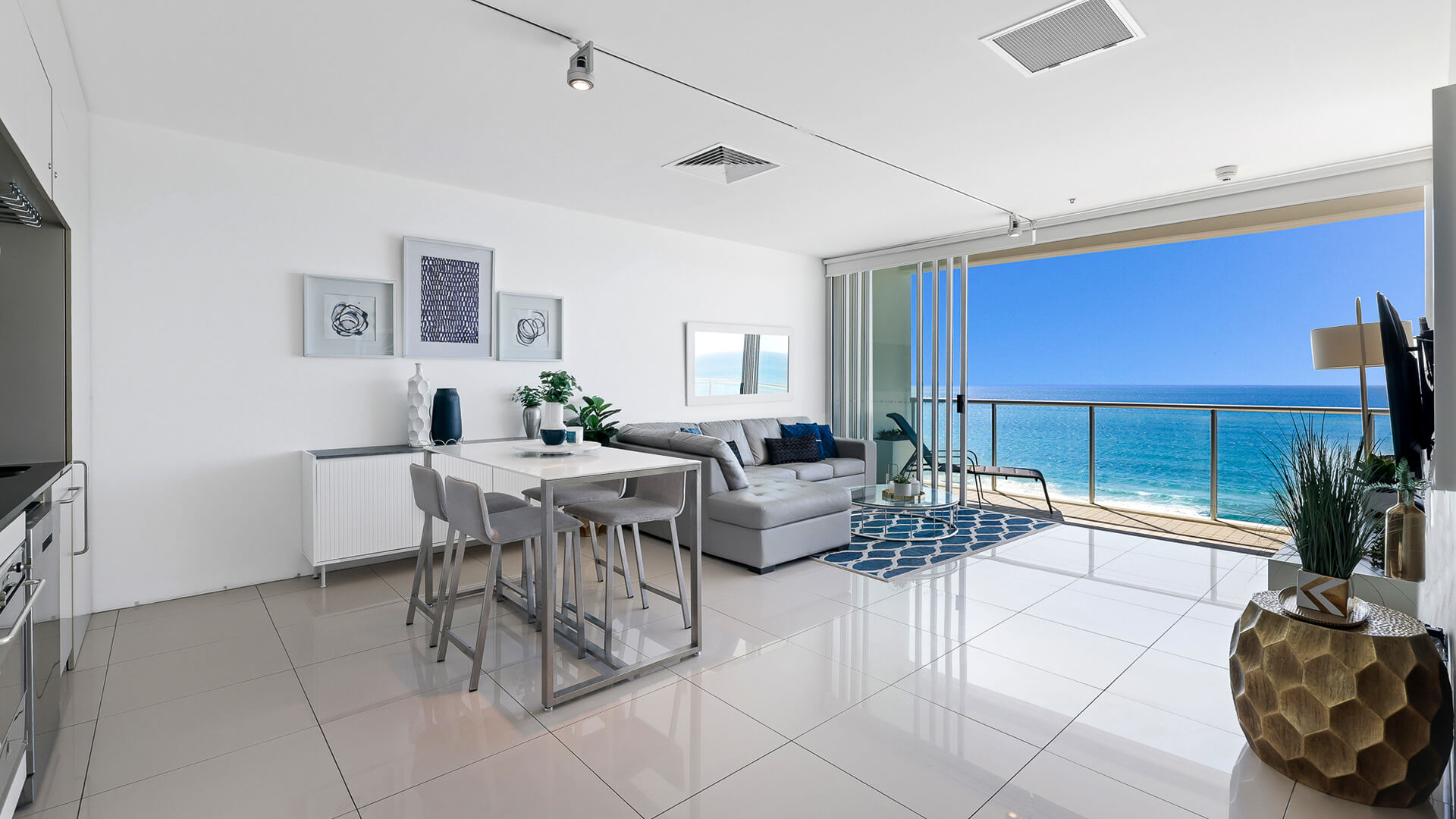 Living room with ocean views and balcony in 1 Bedroom Ocean View Apartment at ULTIQA Air on Broadbeach.