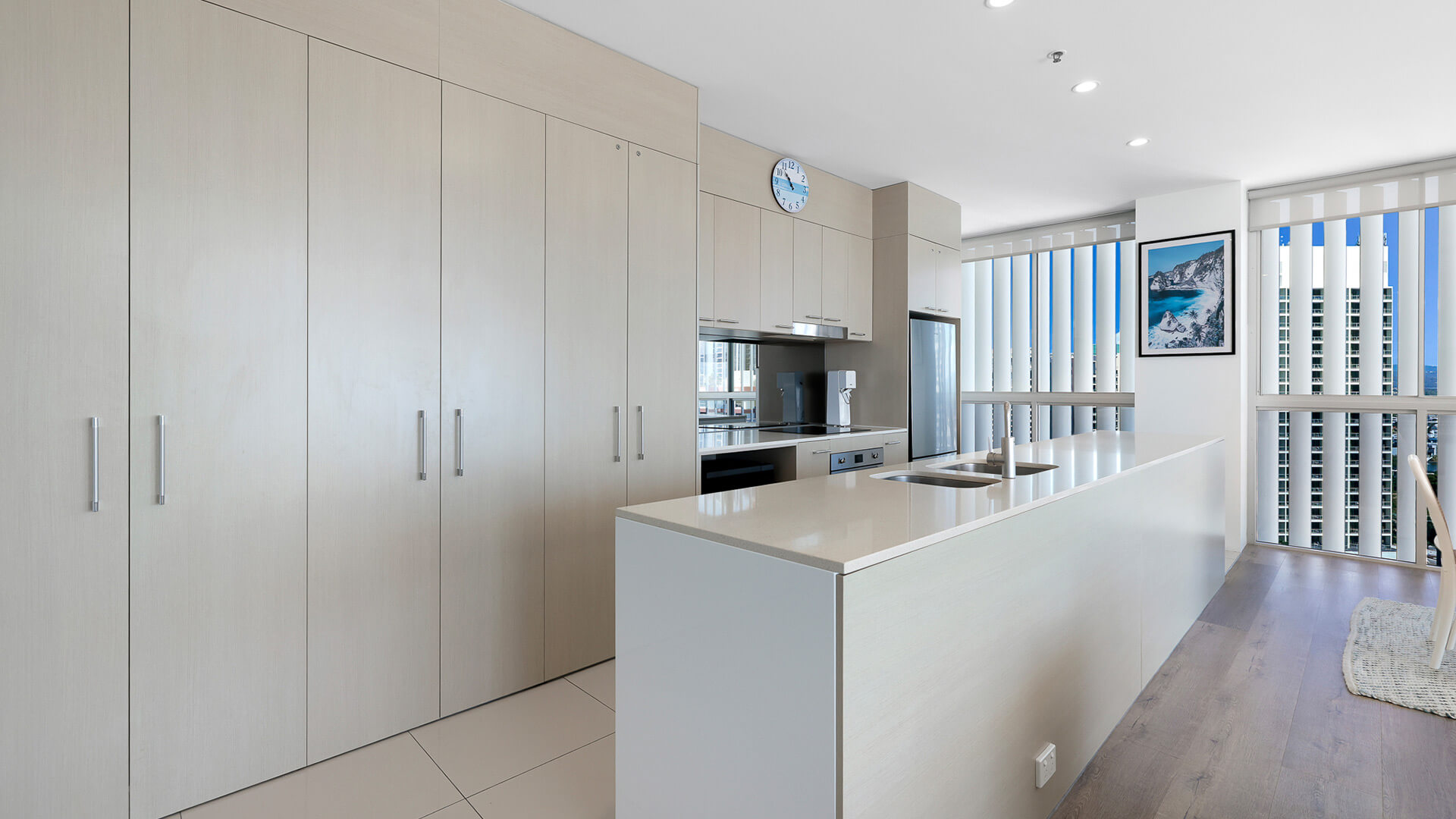 Spacious kitchen with modern appliances and full-height cabinetry in 2 Bedroom Gold Coast View Suite at ULTIQA Air on Broadbeach.