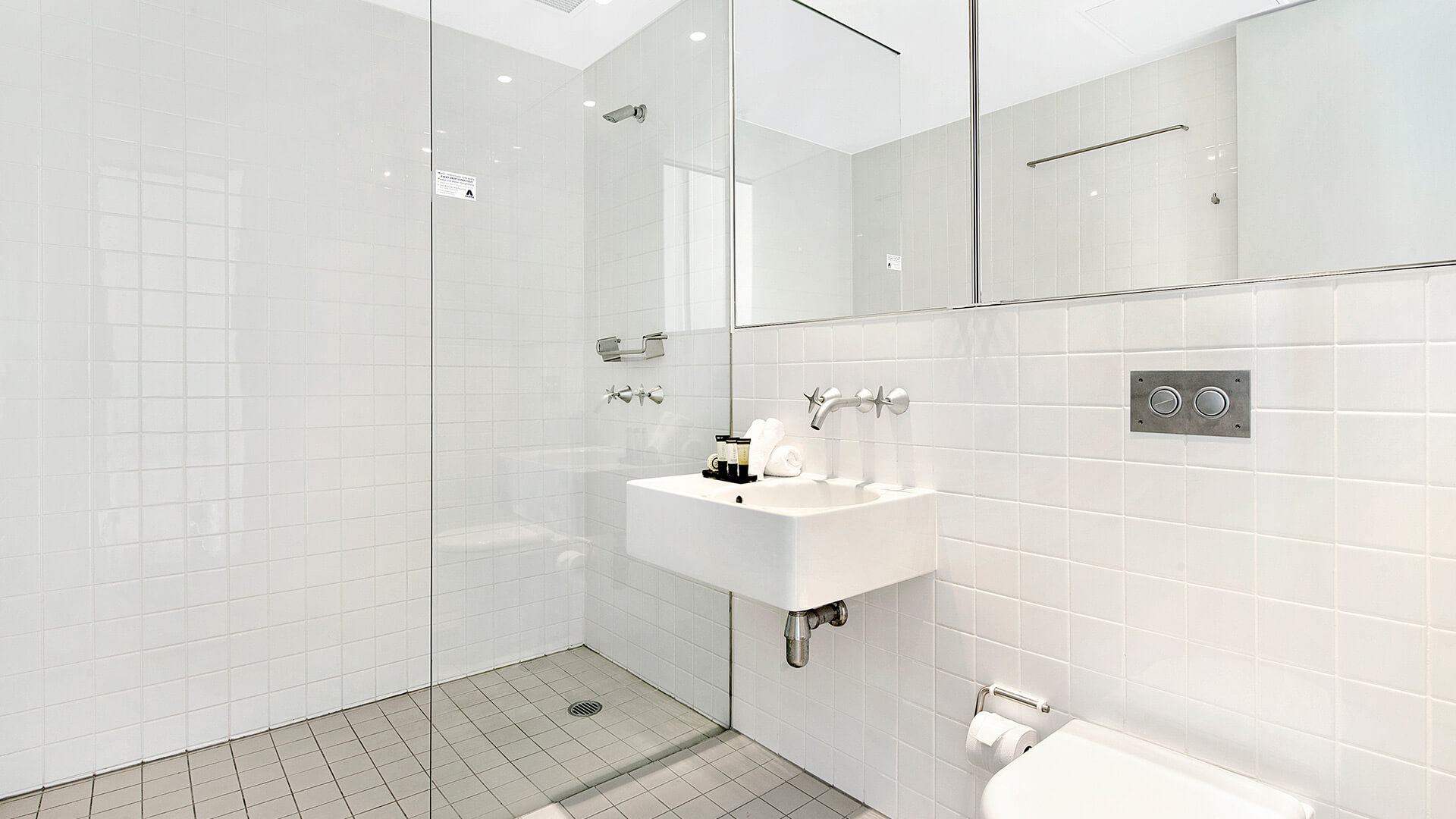 Bathroom with walk-in shower and vanity in 2 Bedroom Gold Coast View Suite at ULTIQA Air on Broadbeach.