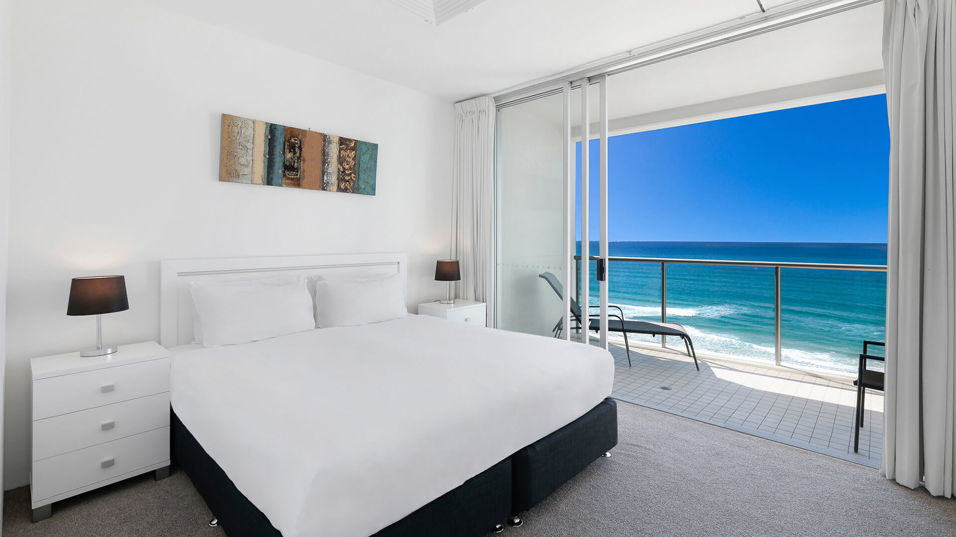 Bedroom with balcony and ocean views in 2 Bedroom Ocean View Apartment at ULTIQA Air on Broadbeach.