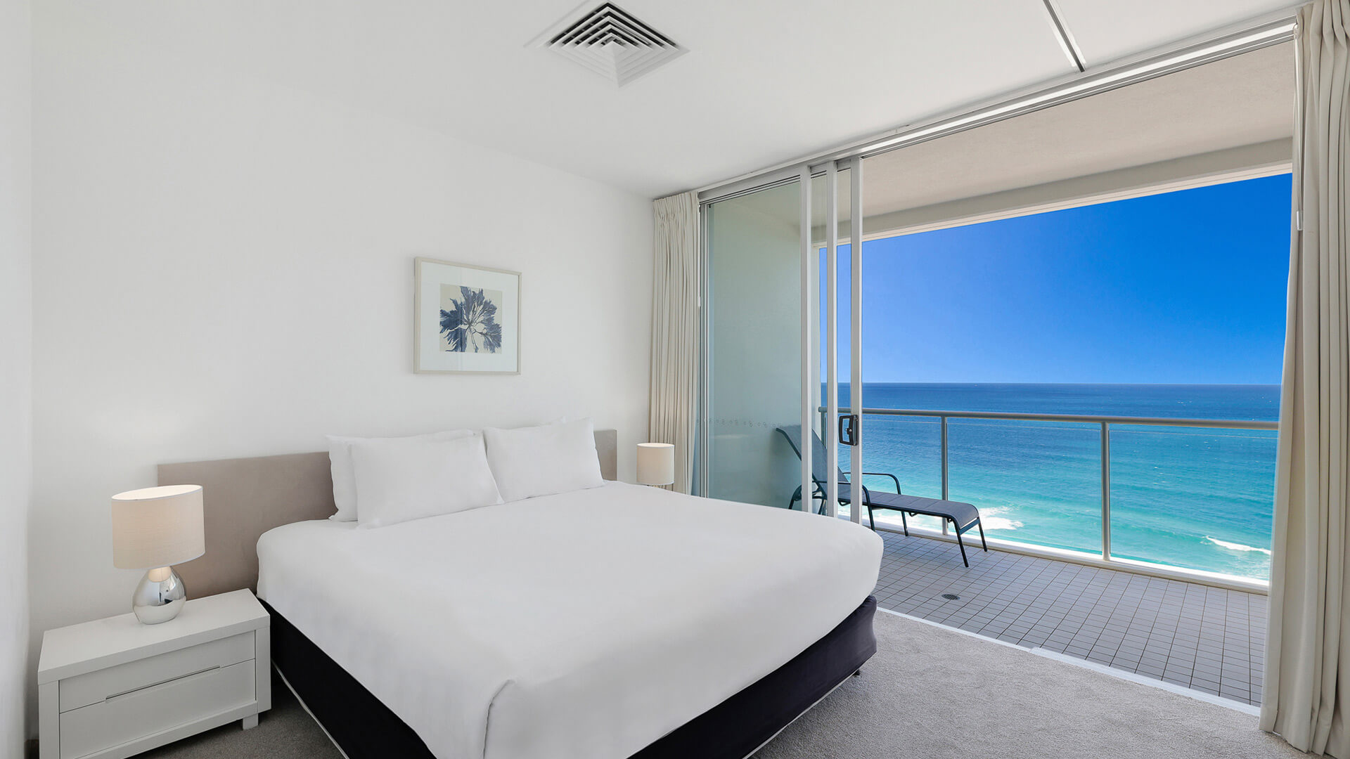 Bedroom with ocean view balcony in 2 Bedroom Ocean View Apartment at ULTIQA Air on Broadbeach.