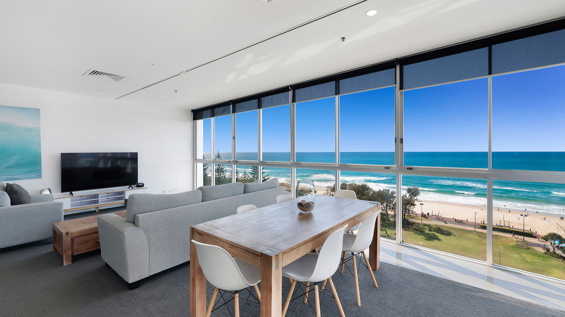 Dining and lounge area with oceanfront views in 2 Bedroom Ocean View Suite at ULTIQA Air on Broadbeach.