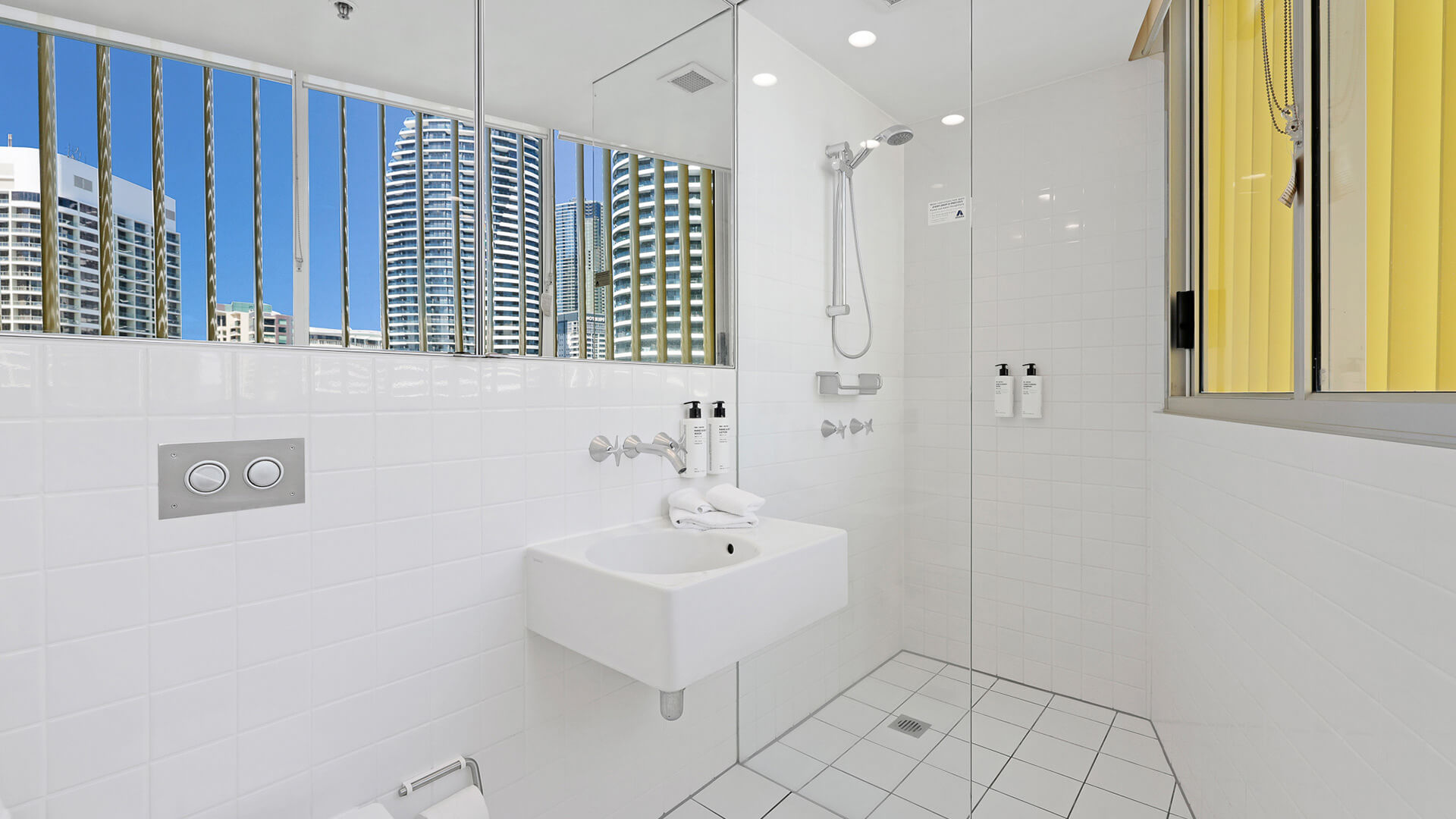Bright bathroom with walk-in shower in 2 Bedroom Ocean View Suite at ULTIQA Air on Broadbeach.