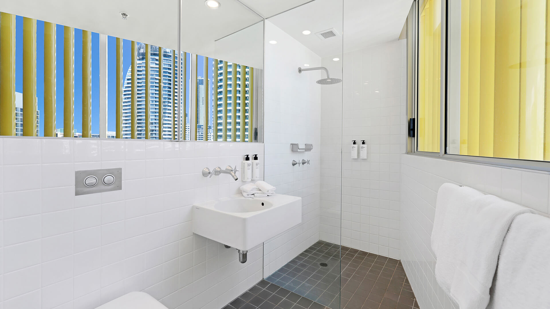 Modern bathroom with walk-in shower in 2 Bedroom Ocean View Suite at ULTIQA Air on Broadbeach.