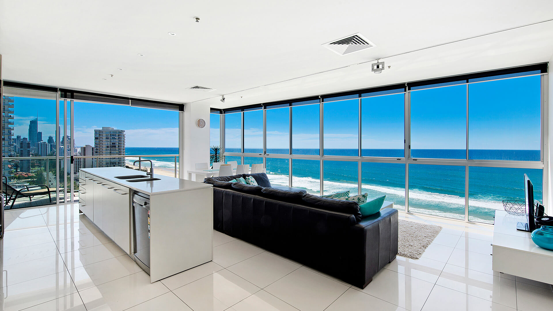 Open-plan living, dining and kitchen with ocean views in 3 Bedroom Apartment at ULTIQA Air on Broadbeach.