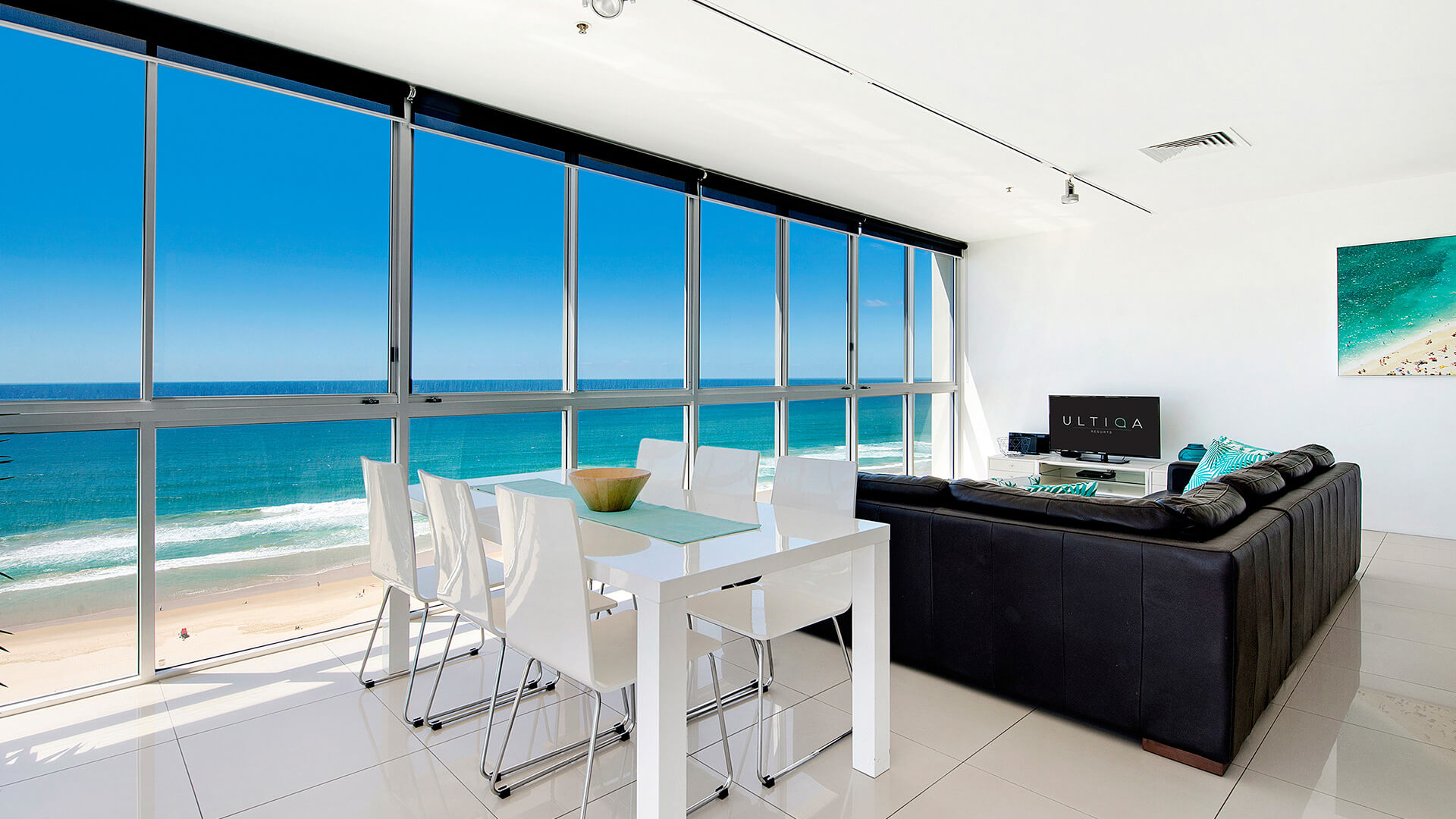 Dining and lounge area with sweeping ocean views in 3 Bedroom Apartment at ULTIQA Air on Broadbeach.