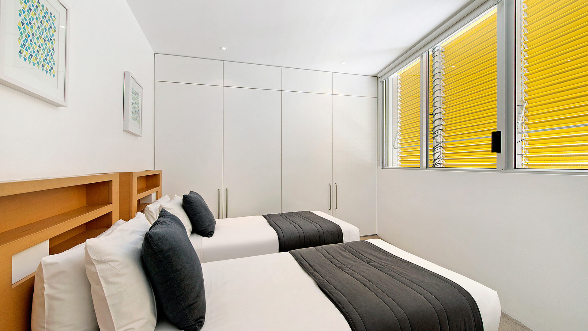 Second bedroom with two single beds in 3 Bedroom Ocean View Apartment at ULTIQA Air on Broadbeach.