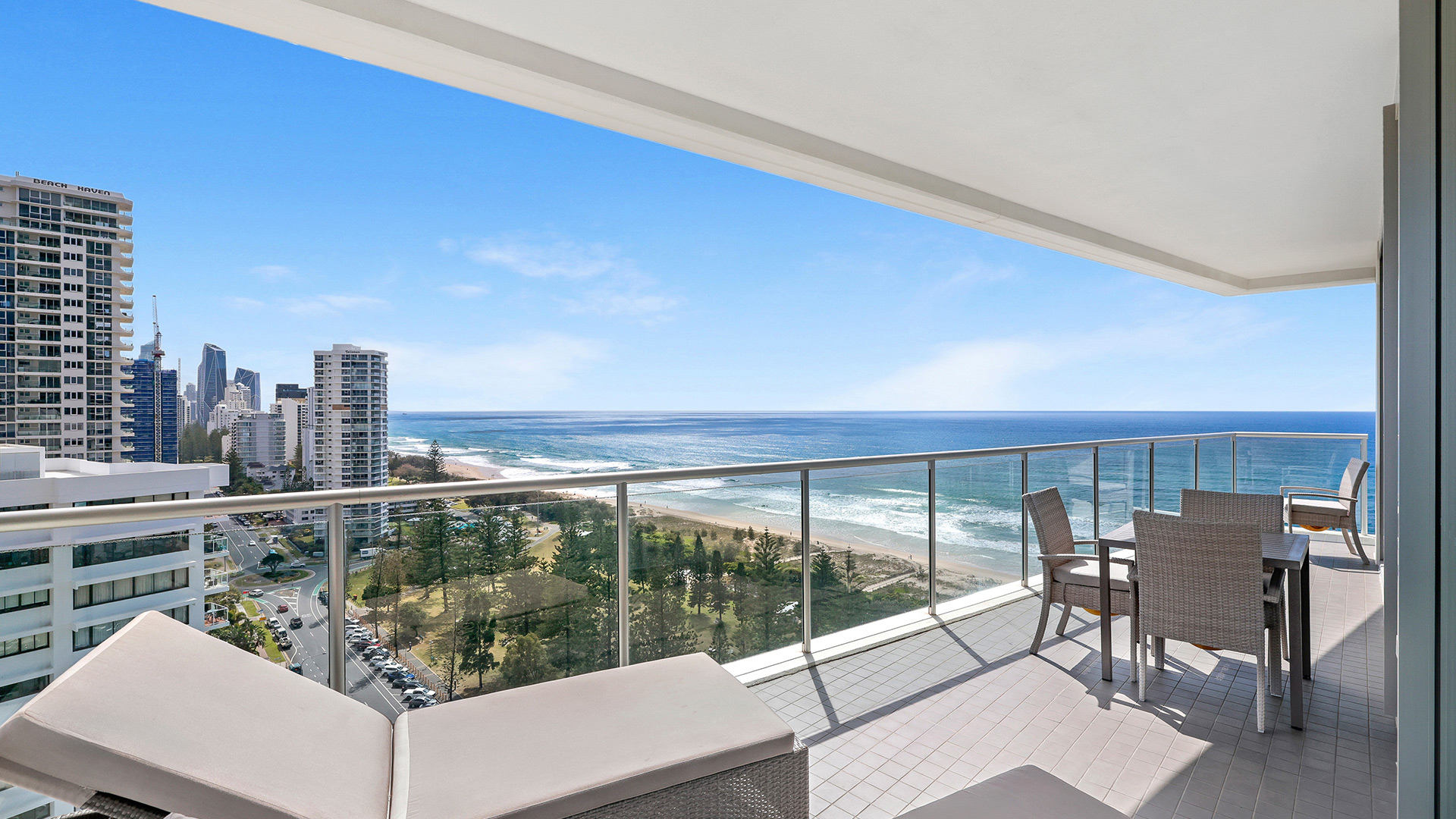 Spacious balcony with outdoor seating and panoramic ocean views at ULTIQA Air on Broadbeach 3 Bedroom Apartment.