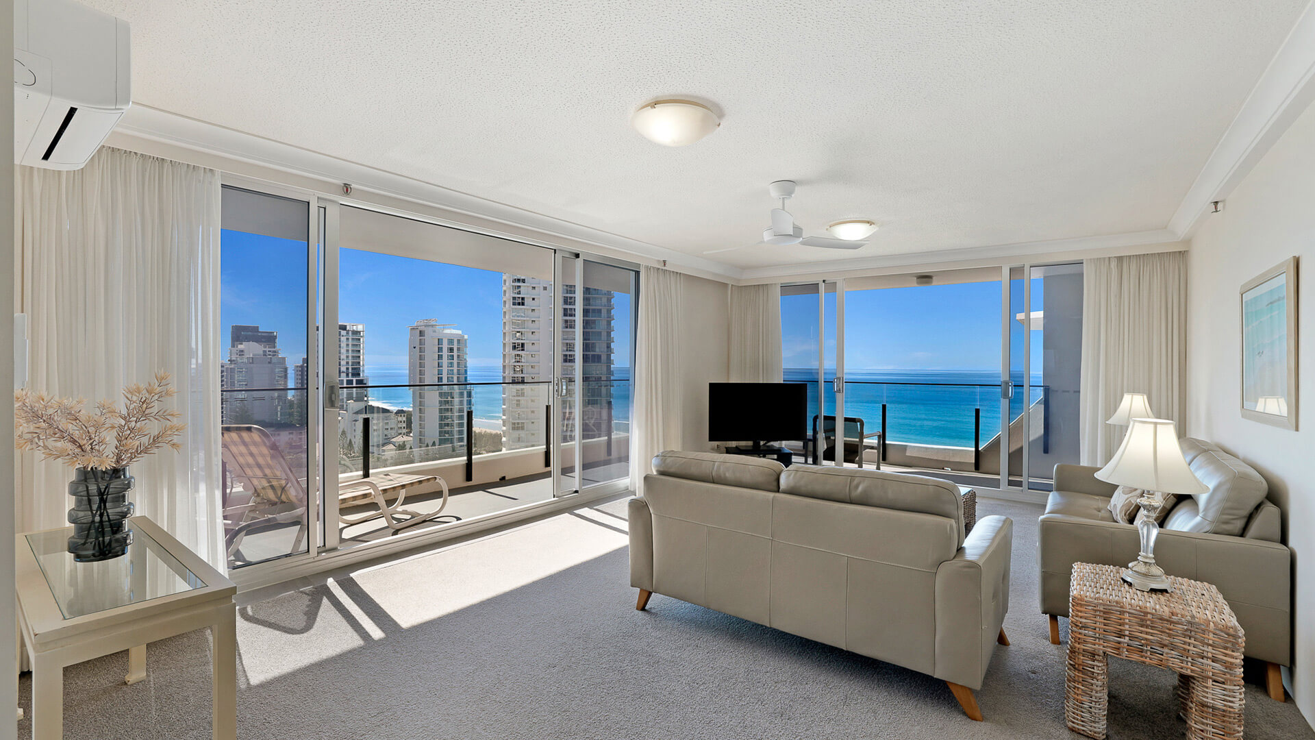 Spacious lounge area with sweeping ocean views in the Standard 2 Bedroom Ocean View Apartment at ULTIQA Beach Haven.