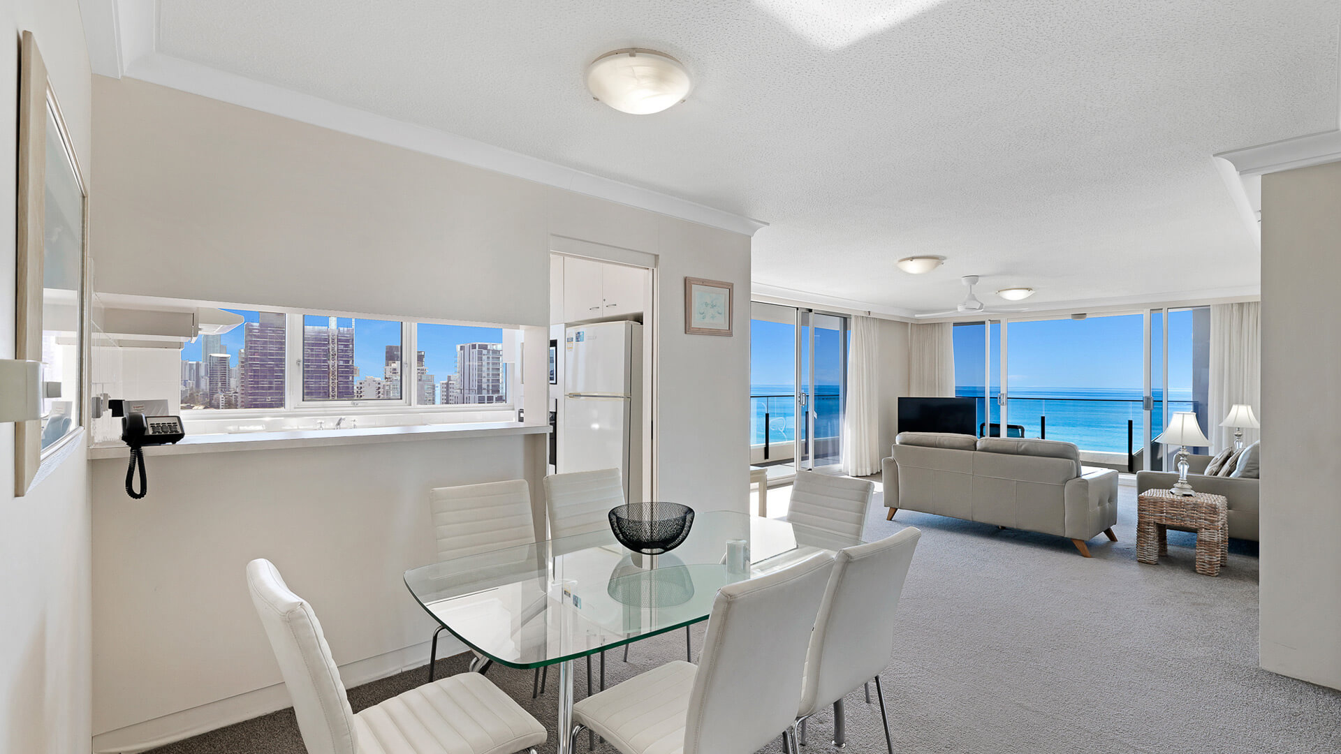 Open-plan dining and lounge area with ocean views in the Standard 2 Bedroom Ocean View Apartment at ULTIQA Beach Haven.