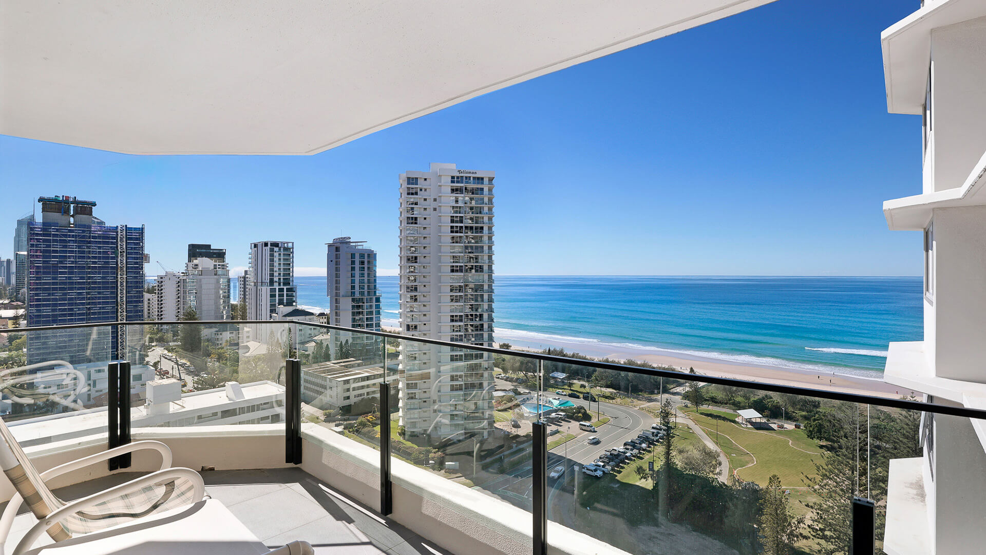 Balcony seating with stunning views of the ocean and Gold Coast skyline from the Standard 2 Bedroom Ocean View Apartment at ULTIQA Beach Haven.
