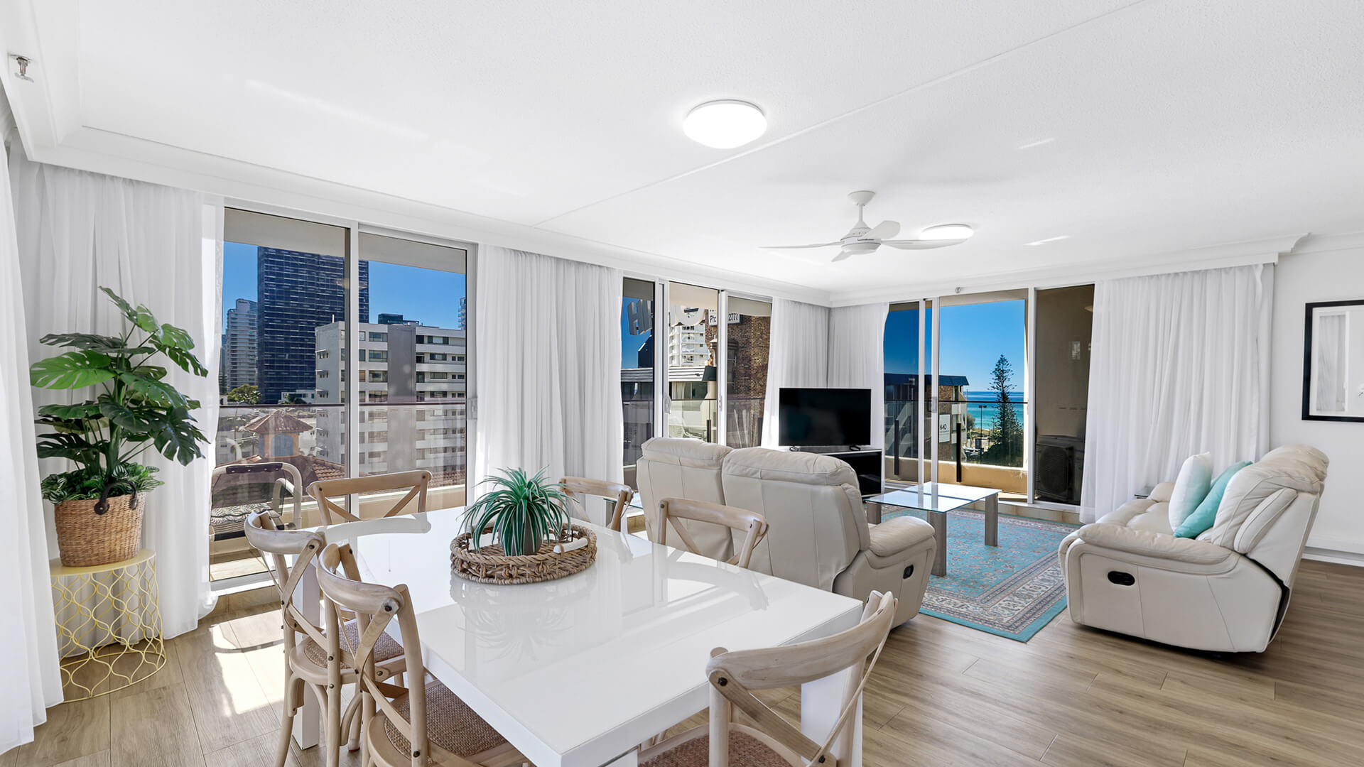 Bright open-plan living and dining space in ULTIQA Beach Haven’s Standard 2 Bedroom Ocean View Apartment with coastal views and natural light.