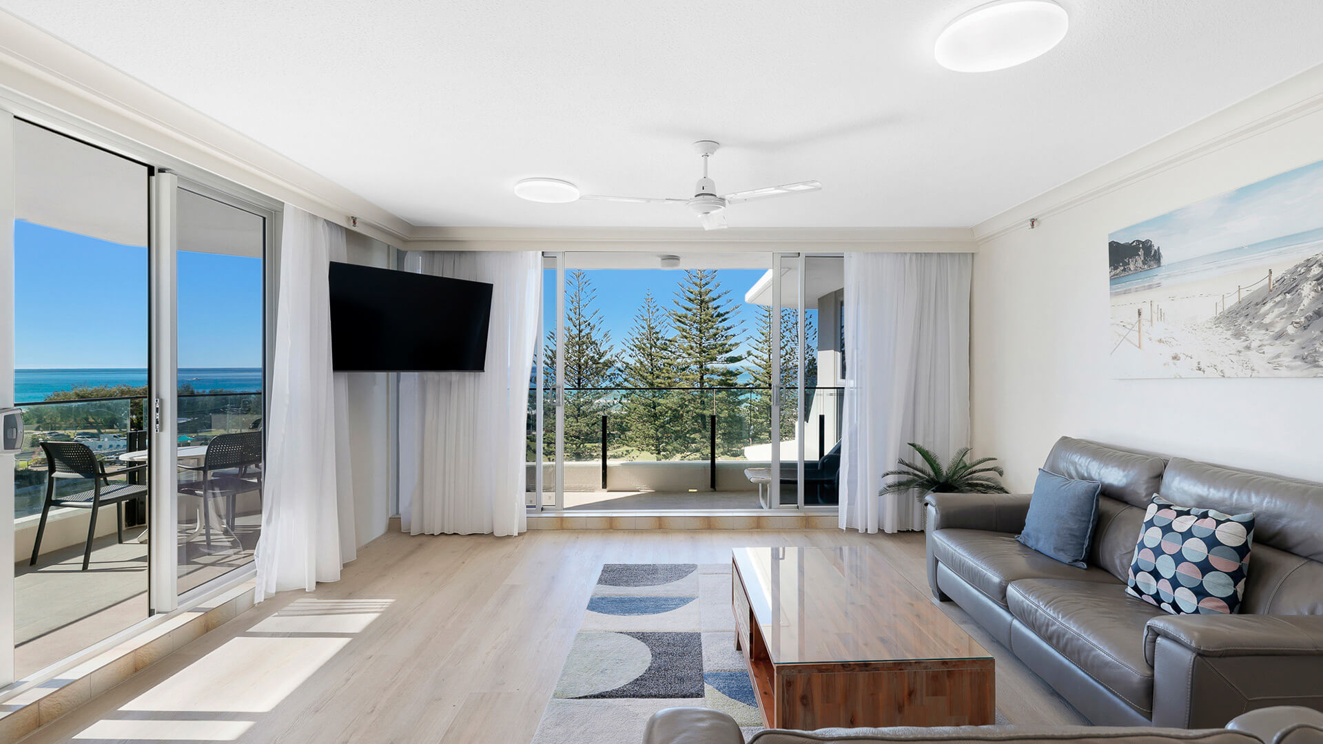 Living room in 2 Bedroom Ocean View Apartment at ULTIQA Beach Haven with balcony, ocean views, and modern furnishings.