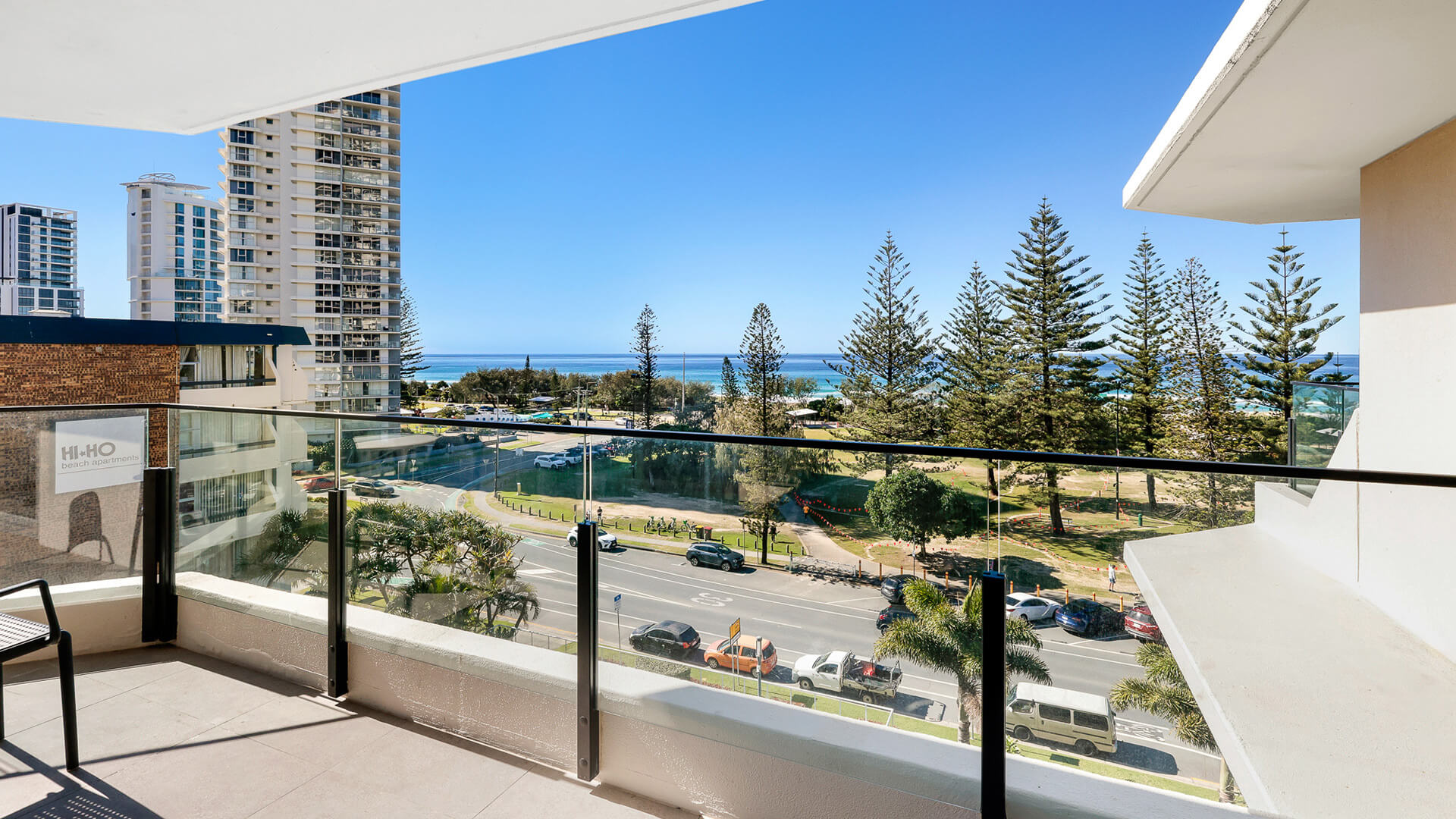 Private balcony of the 2 Bedroom Ocean View Apartment at ULTIQA Beach Haven overlooking the parklands and Pacific Ocean.