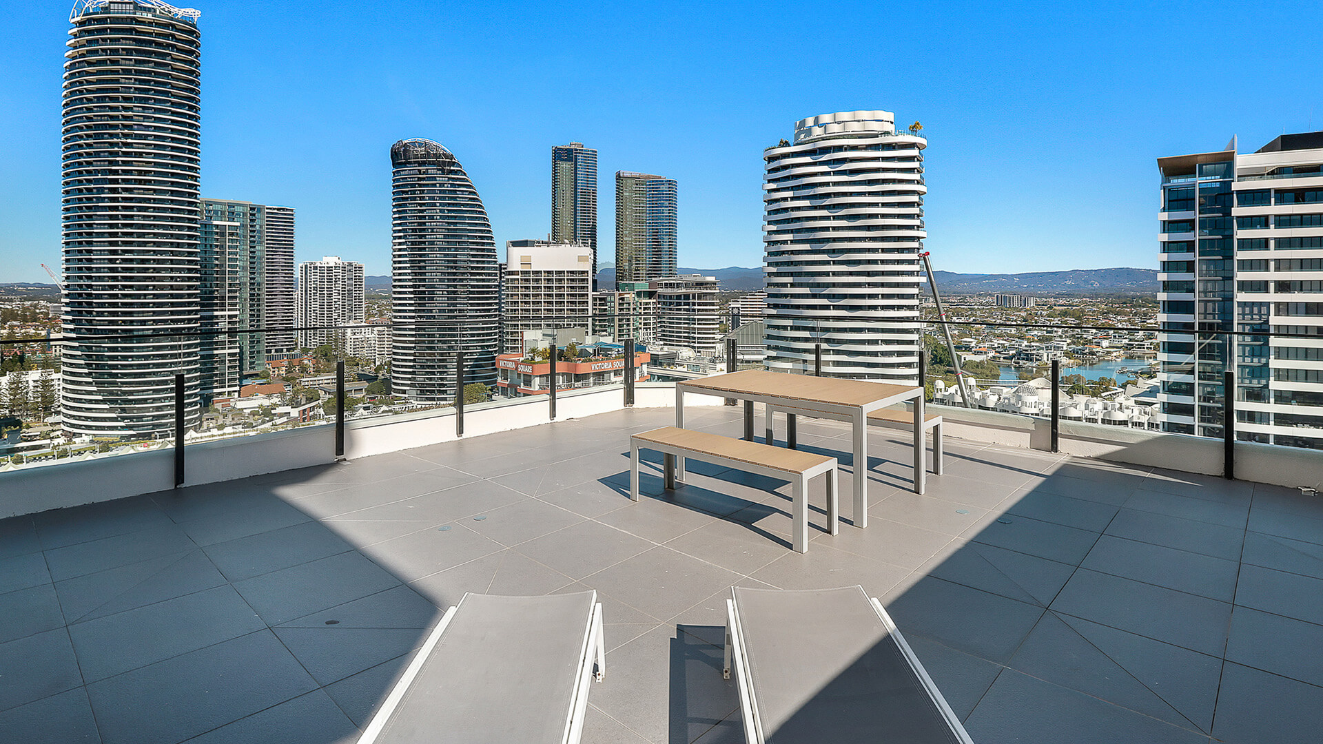 Rooftop terrace, offering skyline views of Broadbeach and the Gold Coast hinterland, perfect for relaxing or outdoor dining.