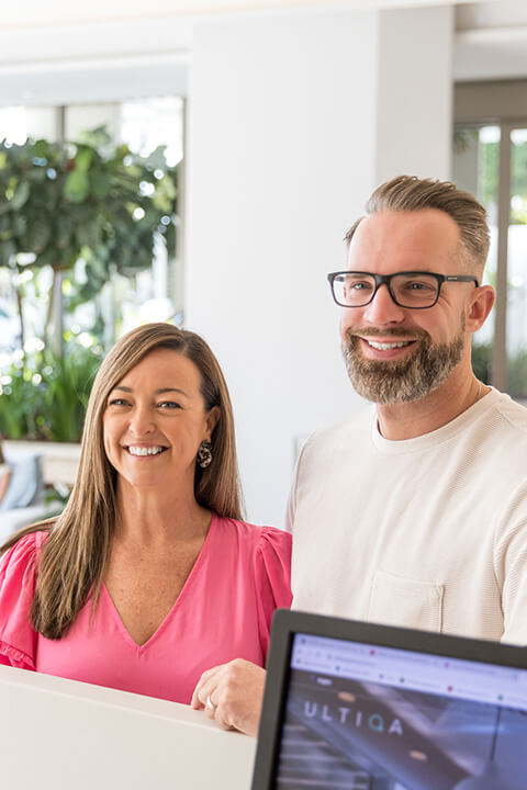 Couple checking in at ULTIQA Signature at Broadbeach, enjoying friendly service and modern Gold Coast accommodation.