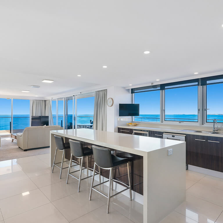 Living area with balcony access and stunning ocean views in the 2 Bedroom Ocean View Apartment at ULTIQA Beach Haven on Broadbeach.